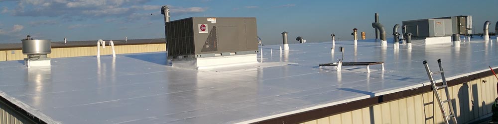 a commercial roof with a new rubber coating applied