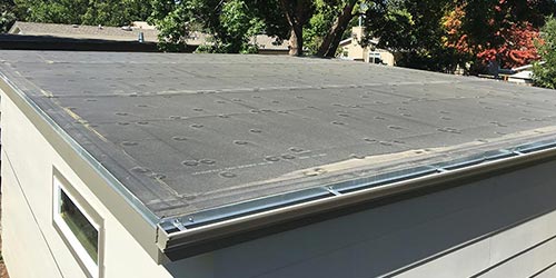 a new epdm rubber roof on a residential garage