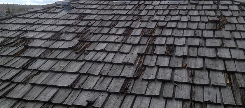 a hail damaged wood shingle roof