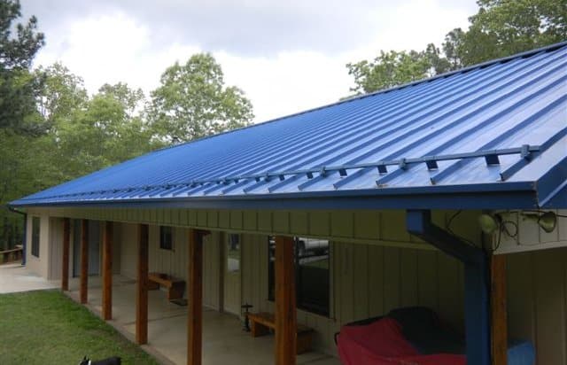 a snow guard installed onto a standing seam metal roof